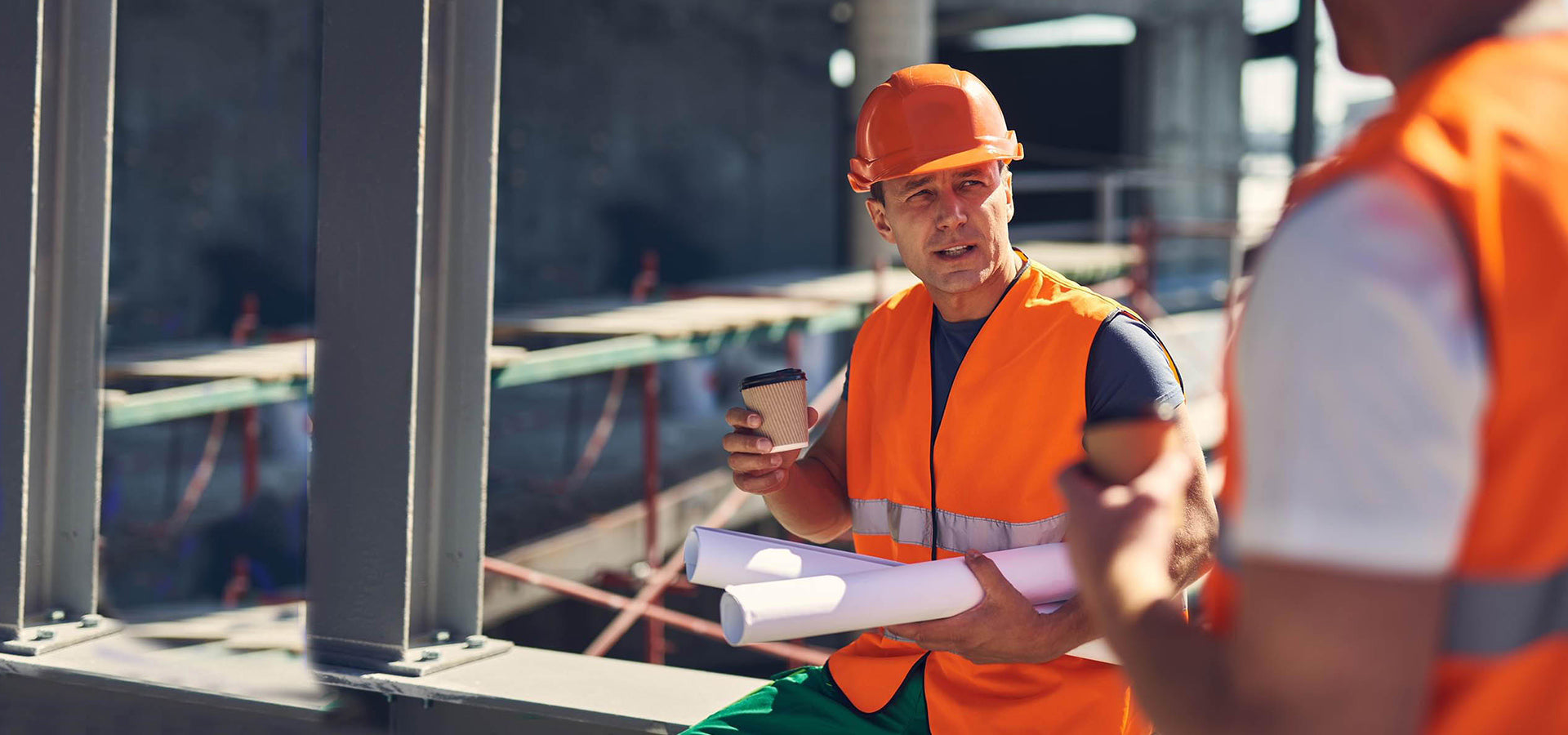 Two construction workers on a building site